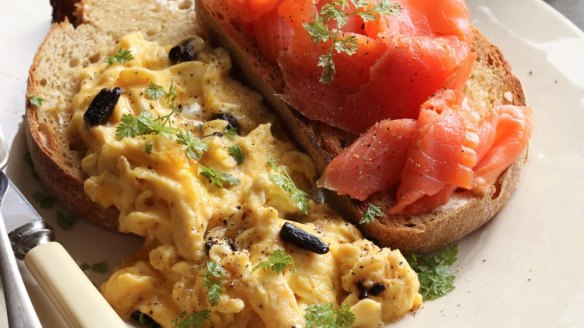 Scrambled eggs with smoked ocean trout and smoky-sweet black garlic. 