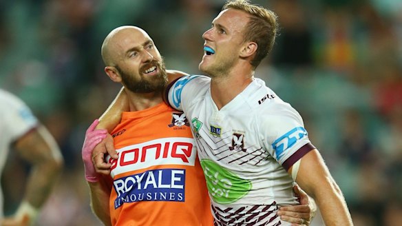 Scans ahead: Daly Cherry-Evans of the Sea Eagles is helped from the field.