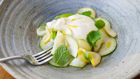 The creamy local burrata is ringed with a delicate zucchini, squash and mint salad.