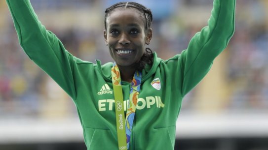 Smashed the world record: Ethiopia's Almaz Ayana celebrates winning the gold medal.