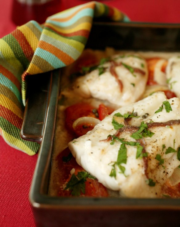 Anchovy-baked fish with tomatoes and onions.