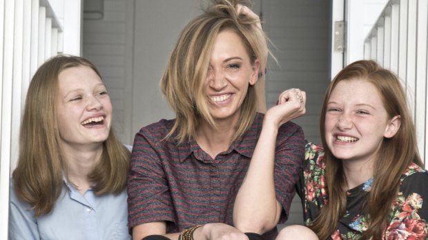 Renae Smith and her daughters Kyah and Paris at home in Newtown. Renae changed her mind about immunising her daughters.

