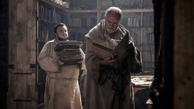 Sam (John Bradley) and the Archmaester (Jim Broadbent) gather some light holiday reading for the beach.