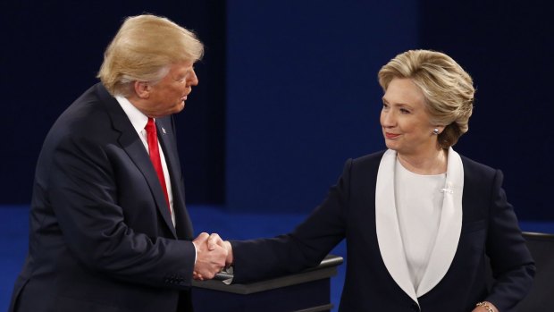 Hillary Clinton shakes hands with Donald Trump after the second debate.