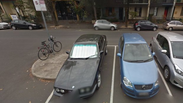 Google Street View from April, 2014 showing Mark Anderson's blue Volkswagen Polo in one of the set of eight permit zone parking bays on Leveson Street. 