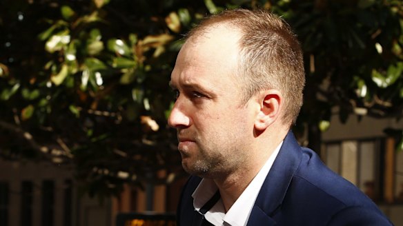 Phillip Hughes' brother Jason arrives at the inquest.