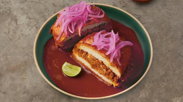 Adjust the spicy sauce of a torta ahogada to your taste preferences.