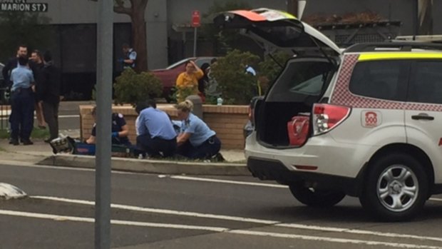 Paramedics treat a child, who was hit by a car in Auburn.