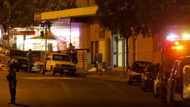 The scene of the shooting on Friday, where witnesses saw two bodies lying on the ground.