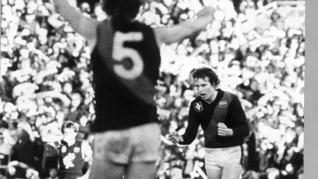 FILE PIC Age library hard copy .  dated 16.8.1981.  Essendon's Neale Daniher, right, after booting the late match-saving goal at Princes Park, looks up to see brother Terry Daniher (NO.  5) waving his congratulations.
