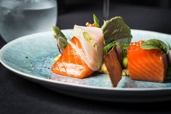 Salmon poached in oil to highlight its buttery flesh.