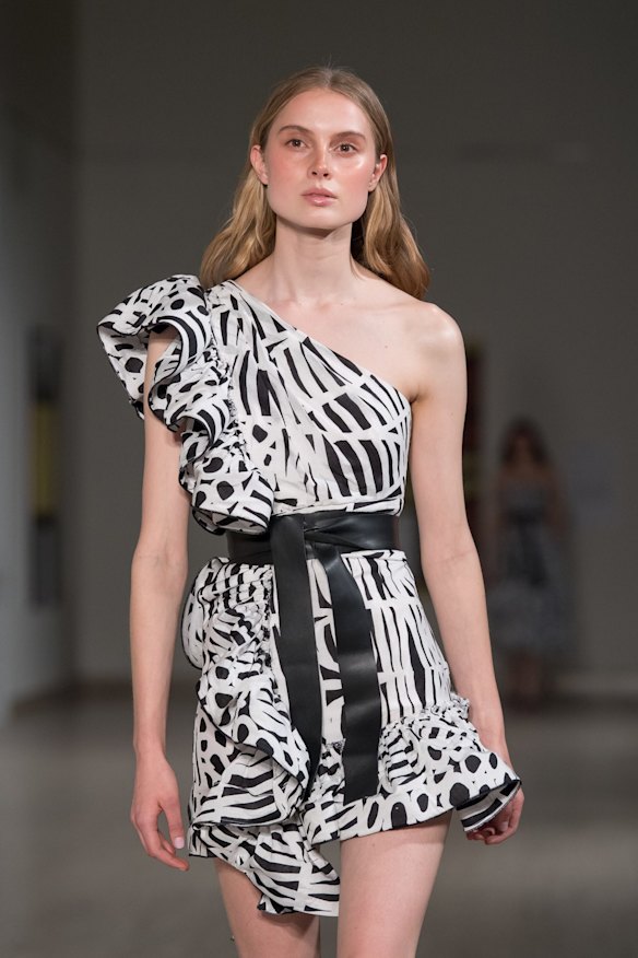 A model showing a dress featuring a print by Indigenous artist Minnie Pwerle.