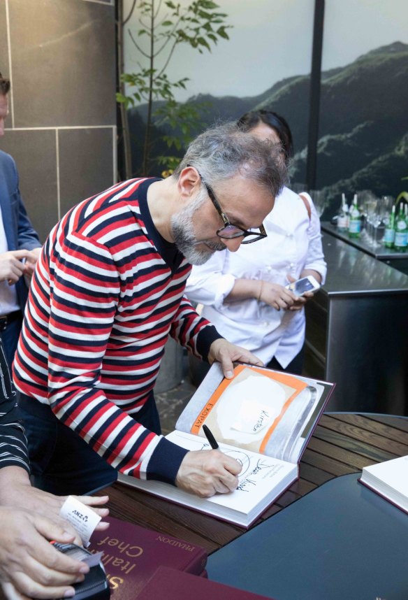 Massimo Bottura signed books and chef coats at the event. 