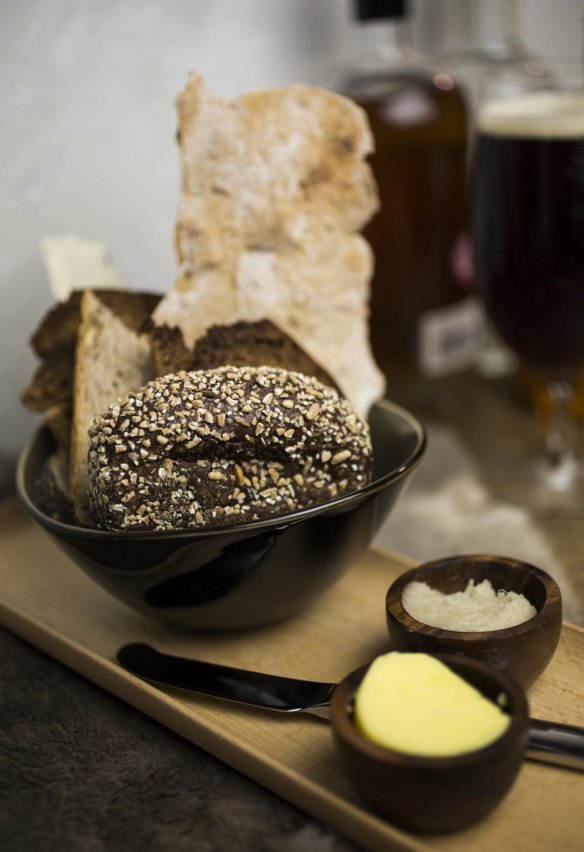 Basket of Nordic-style breads with lard and butter.