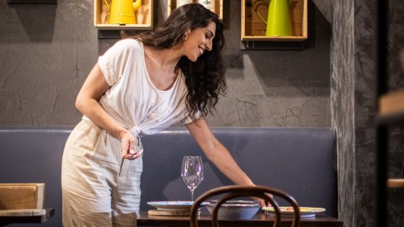 Wooden wine boxes have been repurposed as shelves at Rosella Dining Room and Bar.