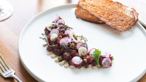 Highly seasoned kangaroo tartare is a sort of reverse Aussie vitello tonnato.