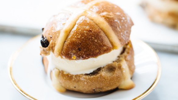 Use a cookie cutter to cut out discs of ice-cream for hot cross bun ice-cream sandwiches.