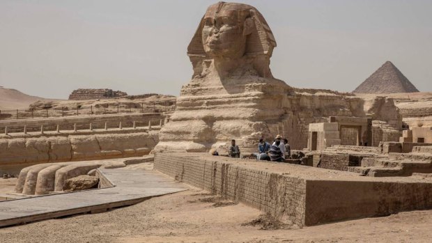 People work at the site of the Sphinx.