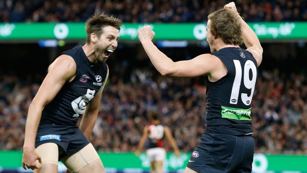 Dale Thomas (left) and Liam Sumner celebrate during Carlton's win over Essendon on Sunday.