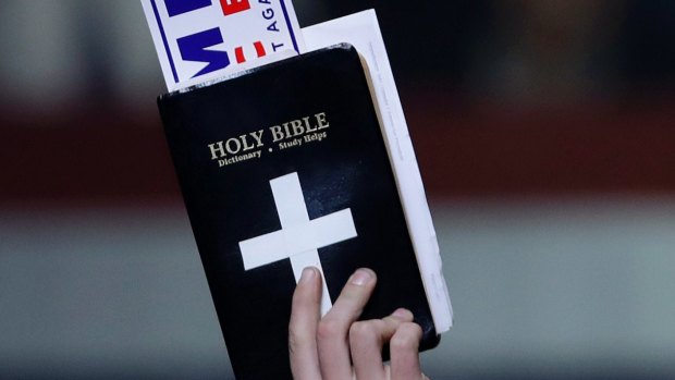 A supporter of Donald Trump holds a Bible during one of his rallies.