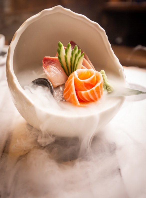 Kingfish sashimi with wafting liquid nitrogen.