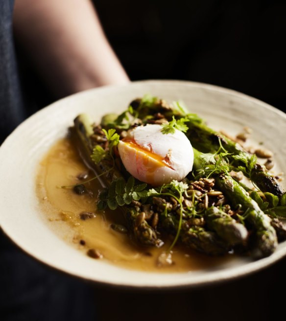 Asparagus with poached egg and toasted seeds.