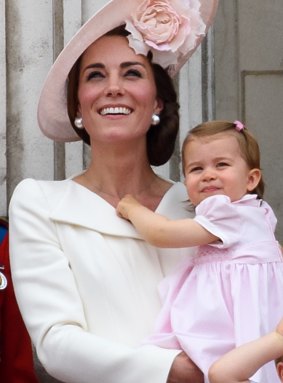 Catherine, Duchess of Cambridge holds daughters Princess Charlotte of Cambridge  in her first appearance on the palace balcony. 