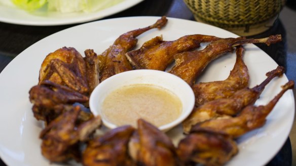Fried quails and sticky rice at Lao Village.