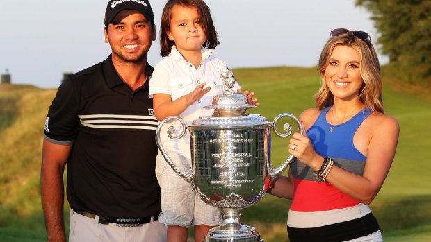 Jason Day with his wife Ellie and son Dash. Day will not travel to Australia this summer as his wife is expecting their second child.