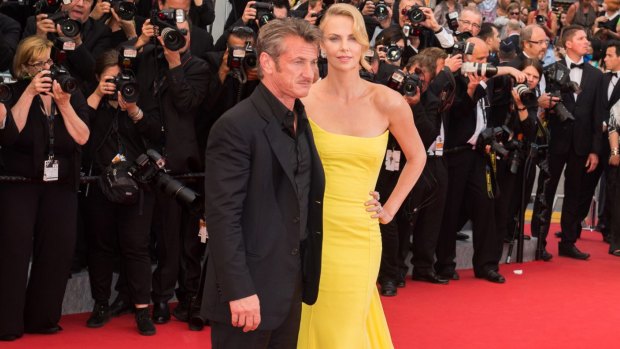 Before the big freeze: Sean Penn and Charlize Theron appear together in Cannes.