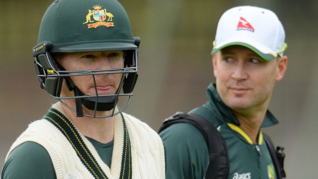 Net result: Chris Rogers returns to the nets as Michael Clarke looks on on Monday.