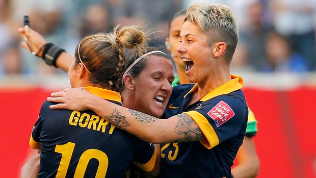 The high point: Lisa De Vanna (centre) celebrates her goal against the USA. She later suffered an ankle injury.