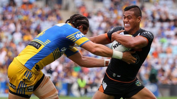 Out: Wests Tigers' Tim Simona (right).