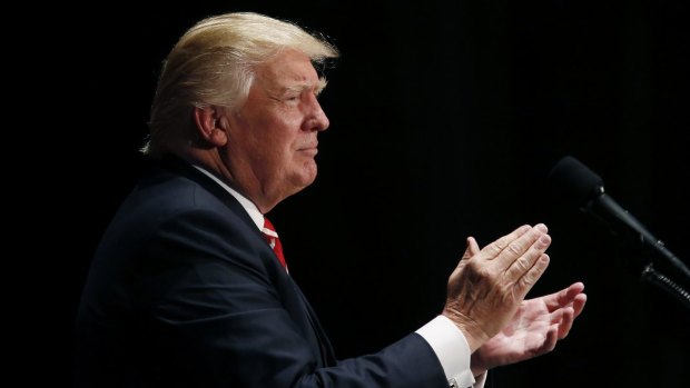 Donald Trump applauds while speaking during a campaign event in Atlanta, Georgia.