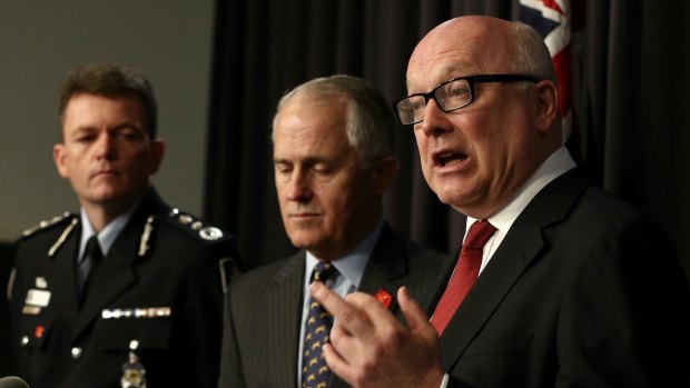 AFP Commissioner Andrew Colvin, former communications minister Malcolm Turnbull, Attorney-General George Brandis.