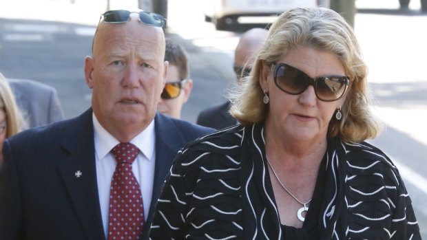 Constable Bill Crews' parents - Kel and Sharon Crews - arrive at the Coroner's Court in Glebe on Monday.