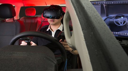 One hundred years of Australian car manufacturing comes to an end next month, as Holden shuts its last factory in Adelaide. Eric Huang uses virtual reality goggles to help design car interiors at the Port Melbourne plant. 27th September 2017. Photo by Jason South