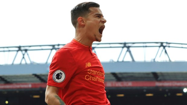 Liverpool's Philippe Coutinho celebrates scoring his side's second goal against Everton at Anfield on Saturday.