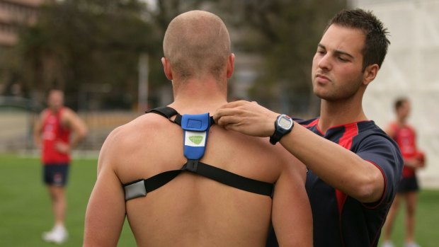 A player is fitted with a GPS unit during training. 