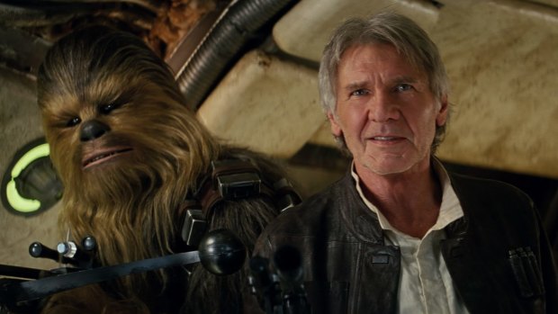 Chewbacca and Harrison Ford as Han Solo in a still from <i>Star Wars: The Force Awakens</i>.