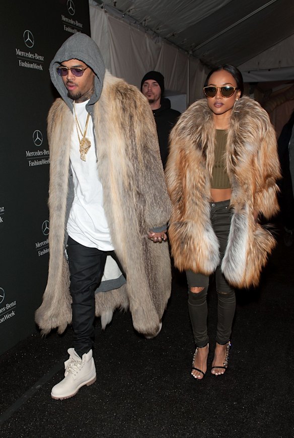 Chris Brown (L) and Karrueche Tran are seen during Mercedes-Benz Fashion Week Fall 2015 at Lincoln Center for the Performing Arts on February 17, 2015 in New York City.