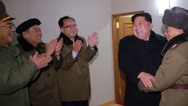 North Korean leader Kim Jong-un celebrates the launch of a missile on Wednesday.