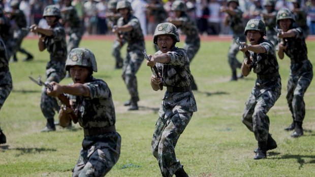 A rising power: People's Liberation Army soldiers practise in Hong Kong in July. China's army hasn't seen real combat in decades.