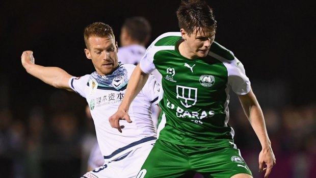 Bentleigh Greens' Tyson Holmes competes with Oliver Bozanic of the Victory during last year's FFA Cup.