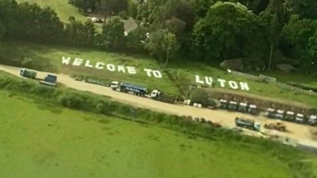 The sign appeared in a field near London Gatwick Airport.