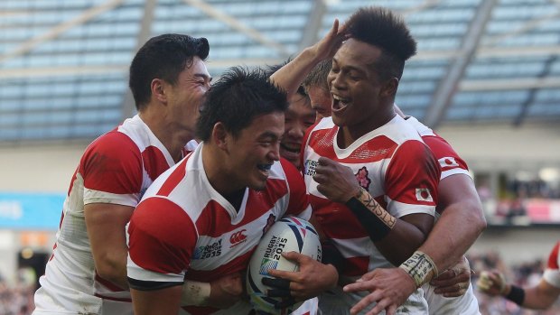 Boilover: Japan players celebrate the try of Ayumu Goromaru against South Africa. 