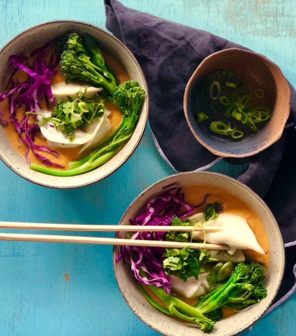 Dumplings swimming in quick red curry sweet potato soup.