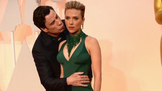 John Travolta embraces (albeit creepily) Scarlett Johansson – the woman in possession of the world's best body.