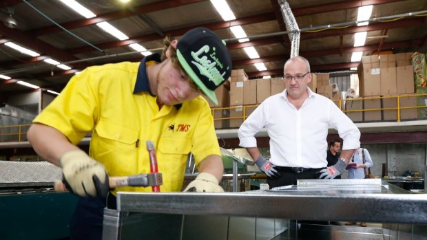 Apprentice Adrian Lenart explains his work to Labor leader Luke Foley at Thermal Mechanical Services in western Sydney.