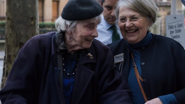 Myra Demetriou, left, the last resident of the Sirius building, enters the NSW Land and Environment Court on Tuesday. 